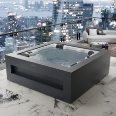 an indoor hot tub on top of a table in front of a cityscape