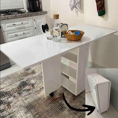 a kitchen with a sink, oven and counter top in the corner next to an area rug on the floor