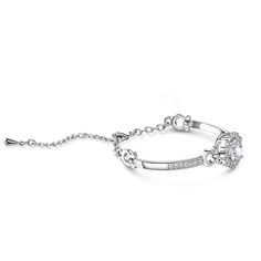 So elegant, so sparkling, this fashion bracelet takes any look up a notch. Crafted in stainless steel, this bracelet features a shimmering round center stone wrapped in a halo frame of smaller stones. Buffed to a brilliant luster, this is a look she'll want to wear every day.Carat Weight: 9.08 ctStone Size: 2.2,2,10 mmNumber of Stones: 33 Stone Shape: RoundStone Color: Diamond WhiteWeight: 18.5 gMaterial: Stainless SteelBracelet Size: 200 mmStone Type: Jeulia® StonePlating Color: Silver Luxury Halo Setting Bracelets, Elegant Round Diamond Bracelet, Elegant Round Bracelets With Halo Setting, Elegant Bracelets With Halo Setting In Cubic Zirconia, Elegant Round Diamond Metal Bracelet, Elegant White Gold Bracelet With Halo Design, Elegant Stainless Steel Bracelets With Diamond Accents, Elegant Round Chain Bracelet With Sparkling Stones, Formal Silver Diamond Bracelet With Halo Setting