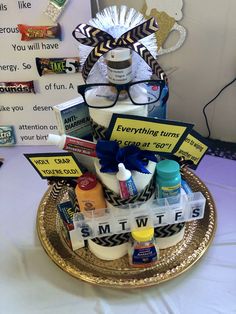 an assortment of personal care items displayed on a gold platter with white table cloth