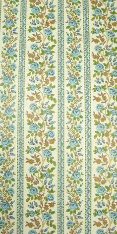 an upholstered wallpaper with blue flowers and green leaves on white groundcloth