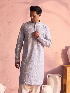 SHRESTHA By VASTRAMAY Men's Sky Blue Georgette Floral Motif Embroidered Kurta A masterpiece in ethnic fashion, this sky blue georgette kurta from SHRESTHA By VASTRAMAY, is a must-have in your wardrobe. It features exquisite floral motif embroidery that adds to its charm. Crafted from georgette fabric, this kurta ensures comfort and style. Features: Color: Sky Blue Fabric: Georgette Design: Floral Motif Embroidery Style: Kurta Specifications: Brand: SHRESTHA By VASTRAMAY Fit: Regular Neck: Mandar Festive Light Blue Kurta With Floral Embroidery, Blue Traditional Wear With Intricate Embroidery For Spring, Spring Blue Traditional Wear With Intricate Embroidery, Festive Light Blue Kurta For Spring, Light Blue Festive Spring Kurta, Traditional Light Blue Kurta For Eid, Traditional Light Blue Kurta For Festive Occasions, Blue Traditional Wear For Spring Festival, Fitted Light Blue Traditional Wear With Long Sleeves