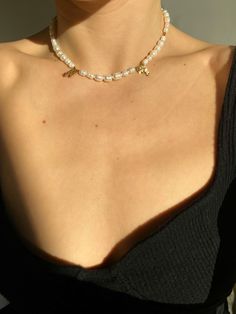 Dainty freshwater pearl choker necklace with details in 24 k Gold or Palladium plated Japanese seed beads. Delicately made by hand. Available in 3 styles: WOVEN BEADED DETAILS 24 k GOLD PLATED: Necklace length: 38 cm / 14.96 inch + 5cm / 2 inch extension chain. Freshwater pearls. Pearl size: 4-5 mm. Color: pearly white . Each cultured pearl is unique, so the shades may vary slightly from the photo. Golden stainless steel lobster claw closure. WOVEN BEADED DETAILS PALLADIUM PLATED: Necklace length: 38 cm / 14.96 inch + 5cm / 2 inch extension chain. Woven details with palladium plated beads (it is a platinum group metal with premium silver color). Freshwater pearls. Pearl size: 4-5 mm. Color: pearly white . Each cultured pearl is unique, so the shades may vary slightly from the photo. Stainl Trendy Gold Beaded Pearl Necklace, Trendy Gold Pearl Choker Necklace, Dainty Beaded Pearl Charm Choker Necklace, Trendy Gold Pearl Choker, Trendy Pearl Necklace With Pearl Charm As Gift, Gift Pearl Chain Choker Beaded Necklaces, Pearl Charm Choker Necklace Gift, Pearl Chain Beaded Choker Necklace As Gift, Pearl Charm Choker Necklace As A Gift