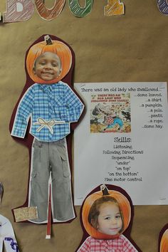 a bulletin board with paper cutouts of children's faces