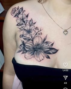 a woman's chest with flowers on it