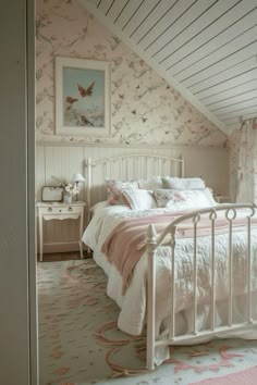 a white bed sitting in a bedroom next to a pink rug on top of a floor