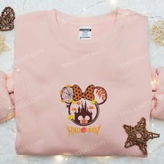 Minnie Halloween Fall Pumpkin Embroidered Sweatshirt, Disney Halloween Embroidered Sweatshirt, Best Halloween Gift Ideas Nestled within the vibrant tapestry of fashion, Tinicloset stands as an emporium of personalized style, where every garment becomes a canvas for self-expression and individuality. Our boutique proudly presents a captivating collection of custom embroidered attire, weaving threads of sophistication and charm into every stitch. At the heart of our cherished assortment rests an e Mouse Logo, Halloween Gift Ideas, Embroidered Sweatshirt, Disney Halloween, Embroidered Sweatshirts, Disney Cartoons, Great Love, Halloween Gift, Halloween Fall