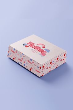 an open box with the word hello kitty printed on it, sitting on a blue background