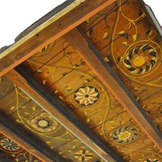 the ceiling is decorated with intricate designs and wood trimmings, as well as flowers