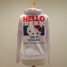 Women Sanrio Hello Kitty Xs White Hoodie Sweatshirt With Front Embroidery. Large Screen Print On Back. Enjoy The Little Things. You Have A Way Of Brightening My Day! Soft Hood To Keep You Warm And Cozy. Treasure Happy Days. 60% Cotton 40% Polyester. Machine Wash Cold Gentle Cycle. Do Not Iron On Design. New Without Tags. Never Worn. One Small Black Dot On Left Upper Sleeve. Shoulder To Shoulder 20 In Armpit To Armpit 20 In Sleeves 23 In Length 24 In White Kawaii Hoodie With Letter Print, White Hooded Kawaii Top, White Kawaii Hoodie Top, Cute White Sweatshirt For Streetwear, Hello Kitty Print Top For Winter Streetwear, White Cotton Kawaii Sweatshirt, White Hello Kitty Sweatshirt For Streetwear, White Hello Kitty Print Sweatshirt For Streetwear, Winter Cotton Tops With Hello Kitty Print