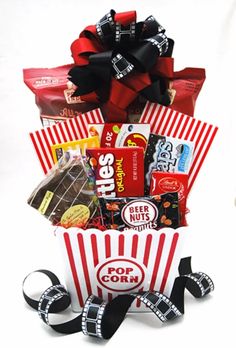 a popcorn bucket filled with snacks and candy