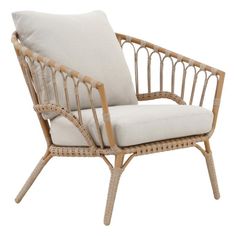 a wicker chair with a white cushion and pillow on it's back end