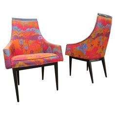 two colorful chairs sitting next to each other