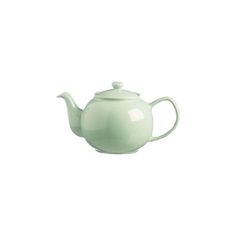 a green teapot sitting on top of a white table