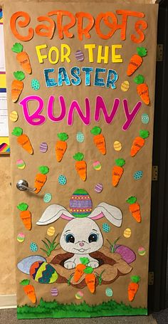 a bulletin board with carrots for the easter bunny