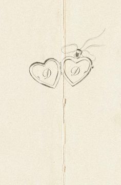 two hearts are drawn on the side of a piece of paper