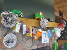 there are many items on the mantle in this living room that is decorated with rocks and paper