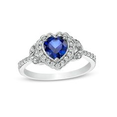 A darling design with whimsical details, this fashion ring captures her feminine style. Crafted in sterling silver, this choice showcases a 6.0mm heart-shaped bright blue lab-created sapphire embraced by a frame of shimmering white lab-created sapphires with a scalloped border. Sculpted leaf-like marquise shapes flank the center and glisten with white lab-created sapphires. Graduated-size white lab-created sapphires line the tapered shank to complete the look. Buffed to a brilliant luster, this Framed Leaves, Scalloped Border, White Lab, Peoples Jewellers, Fashion Ring, Sapphire Stone, Stone Heart, Blue Heart, Flower Ring