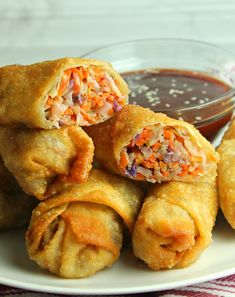 some fried food on a plate with dipping sauce