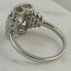 a silver ring with diamonds on it