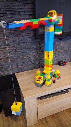 there is a lego crane on the table