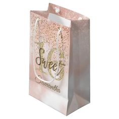 a pink and gold paper bag with the word sweet savannah on it's front