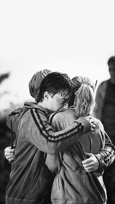 black and white photograph of two people hugging each other