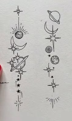 a drawing of different planets and stars on paper