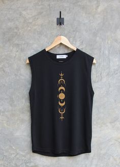 ✿ WELCOME TO MY SHOP ✿ More Shirt ► https://www.etsy.com/shop/igetherproject Material : Polyester 80% Cotton 20% Sleeve length : Muscle tank tops, workout tank tops Styles : Regular Women Fit Printed with eco-friendly water-based inks. Color shirt : Black, Charcoal, Blue, Peach Color print : White & black etc. ■ WASHING INSTRUCTIONS ��■ Turn garment inside out. Hand wash. Lay flat to dry. Do not bleach/dry-clean Do not iron directly onto the print ■ Please refer to the size chart in the last image Tank Tops Workout, Charcoal Blue, Moon Gold, Moon Graphic, Gold Shirt, Moon Shirt, Muscle Tank Tops, Blue Peach, Color Shirt