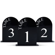 three black table numbers with white letters are shown in this set, and the number is 1 - 2