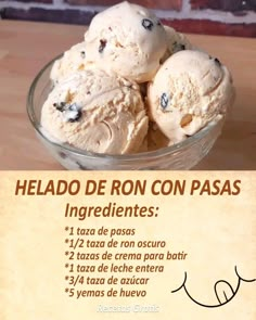 ice cream with blueberries in a glass bowl on a wooden table next to a brick wall