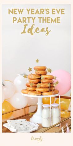 new year's eve party theme ideas with donuts on a cake stand and balloons