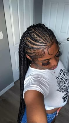 a woman with long box braids in her hair