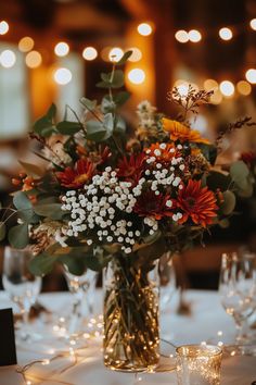 Creative and budget-friendly wedding table decorations with rustic and elegant touches. Budget Wedding Table, Wedding Table Decor Ideas, Mason Jar Fairy Lights, Boho Garden Party, Decorations On A Budget, Wedding Table Setup, Elegant Wedding Themes, Rustic Wedding Table Decor, Table Cloth Decorations