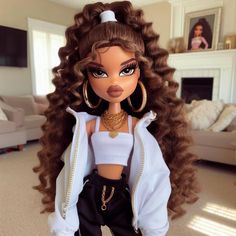 a doll with long brown hair wearing black pants and a white top is standing in a living room