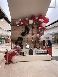 a room with balloons and musical instruments on the wall