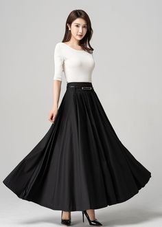 "This black pleated maxi skirt is the perfect combination of comfort and style. The elegant and flowy design is made with high-quality materials that drape beautifully on any figure. The versatile style and classic color make it easy to dress up or down, so you can wear it for any occasion. The pleated design adds a touch of femininity and movement to your look, making it perfect for choosing. DETAIL * 100% polyester * Pleated skirt * Ankle Length * Two pockets * Belt loops on waistband * Side z Solid Pleated Maxi Skirt For Party, Elegant Maxi Length Skirt, Full Length Black Pleated Skirt, Black Pleated Full-length Skirt, Elegant Long Pleated Maxi Skirt, Black Full-length Flowing Pleated Skirt, Formal Solid Color Pleated Maxi Skirt, Formal Solid Pleated Maxi Skirt, Black Full Length Flowy Pleated Skirt