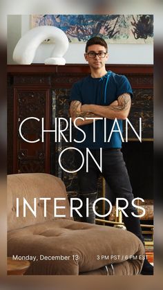 a man standing in front of a fireplace with the words christian on interiors above him