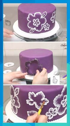 someone is decorating a purple cake with white flowers on the top and bottom tier