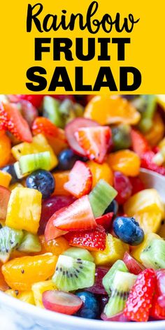 a bowl full of fruit salad with the words rainbow fruit salad on top and below it