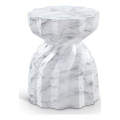 a white marble stool sitting on top of a table