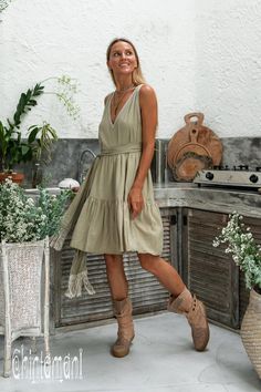 "⫸ We ship by EXPRESS EMS now for fast & safe delivery! Tiered Midi Dress is another playful addition to our Boho Alma Libra collection. Gorgeously feminine and so pleasant to wear, it will look amazing with heeled sandals or our ethnic canvas boots. Open back and midi length adds the charm and makes it even more suitable for hot and lazy summer days. It is very floaty by design. Light, soft and natural bamboo fabric brings this idea to life perfectly. It is available in classic black, dusty V-neck Sundress For Picnic, Cottagecore V-neck Dress With Ruffles, Cotton V-neck Dress For Picnic, Green Mini Dress For Picnic, Cottagecore Midi Dress For Vacation, Sleeveless Cottagecore Dress For Brunch, Chic V-neck Dresses For Picnic, Cottagecore Midi Dresses For Picnic, Cottagecore Sleeveless Vacation Dress