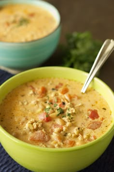 two bowls filled with soup on top of a table