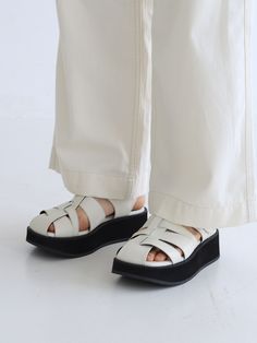 Editor's NotesThese sandals feature simple design and light weight. It is good to wear for various activities. - Silver buckle point- Unique strap- Summer shoes- Daily item- Goes well with any casual looksMeasurements(in.)- Size: KR 225MM(US 5.5) ~ KR 255MM(US 8.5)- Heel Height: 1.57 in.*Fits true to size.Composition & Care- Upper: Cowhide- Sole: Rubber- Please check the care labelDesigner- by MOL:pin White Slingback Sandals With Arch Support, White Round Toe Slingback Sandals With Arch Support, White Slingback Sandals With Arch Support And Round Toe, Modern White Sandals With Leather Sole, Modern White Sport Sandals With Round Toe, Modern Sandals With Woven Sole And Round Toe, Modern White Sport Sandals, Modern White Sandals With Rubber Sole, White Leather Closed Toe Sport Sandals