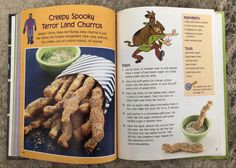 an open children's book with pictures of food in it and the title, creepy spooky terrier land churros