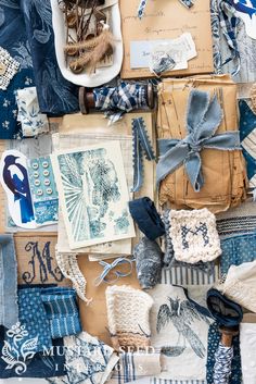 an assortment of blue and white items are displayed on top of a piece of paper