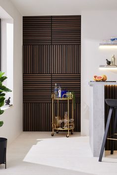 a bar cart sitting in the middle of a room