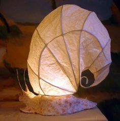 a white paper lantern sitting on top of a table