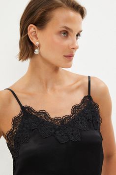 Lace Trim Cami - Black - Edged with ethereal lace, this silky satin cami adds a feminine twist to sharp tailoring. Slender straps frame each shoulder, offsetting a V-neckline and matching V-cut back.Style: CamiFabric: SatinLength: RegularNeckline: V NeckSleeve Length: Long Sleeve Feminine Lingerie, Lace Trim Cami, Latest Tops, Satin Cami, Black Camis, V Cut, V Cuts, Lace Tops, Lace Trim