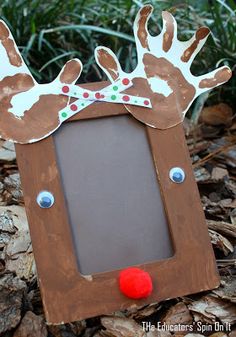 a wooden frame decorated with reindeer's head and antlers